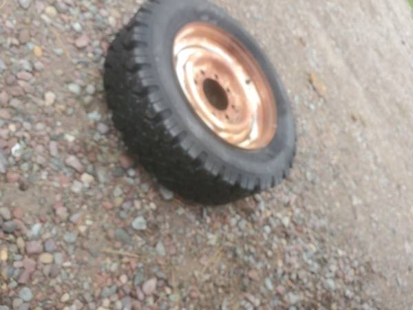 4 Cheap GOODYEAR studded snow tires mounted on 8 lug steel wheels